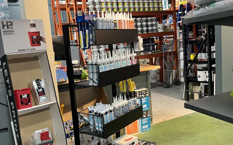 Painting sundries including brushes, rollers, trays, tape, and accessories